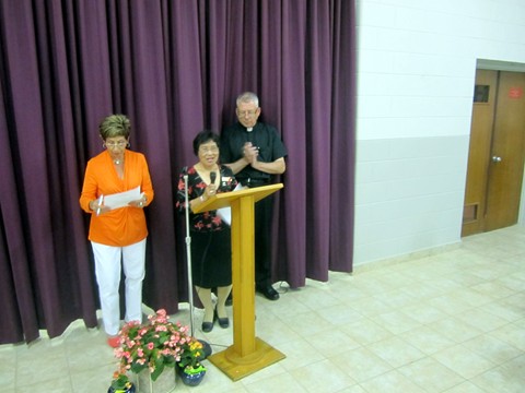 CWL President Vicki Elatico thanks Father Michael 